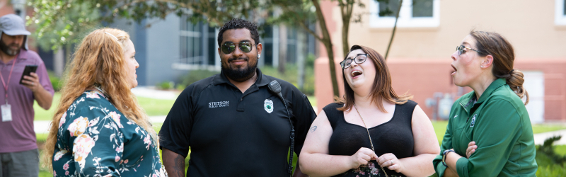 Staff engaging in a laugh on a beautiful sunny day in Florida.